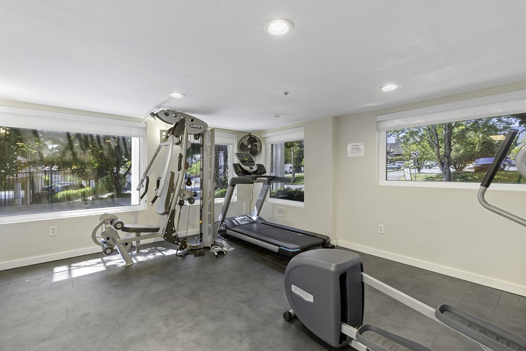 Fitness Facilities with a Treadmill, Weights, and Oversized Windows for an Abundance of Light  Fitness Facilities with a Treadmill, Weights, and Oversized Windows for an Abundance of Light  at Sir Gallahad Apartment Homes, Bellevue, WA